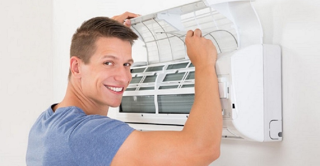 An engineer carrying out an air conditioning repair in Braintree