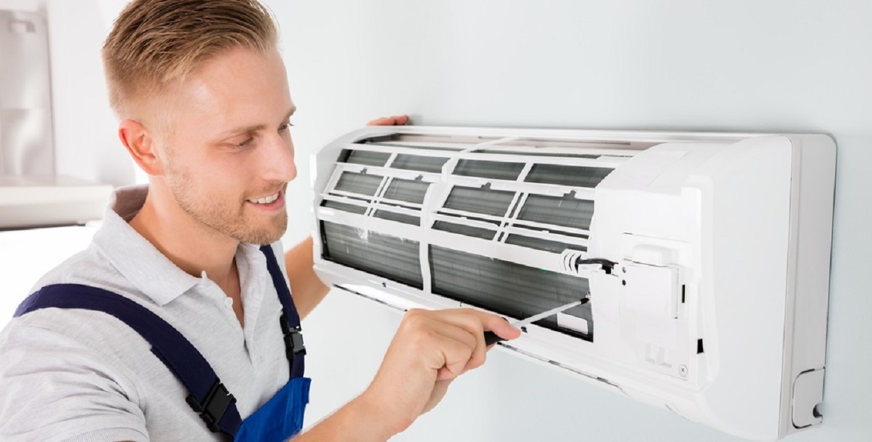An engineer carrying out an air con maintenance in Rayleigh, Essex